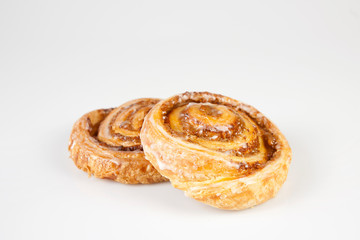 cinnamon buns on white background