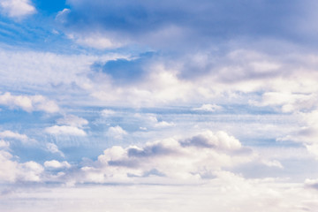 Naklejka na ściany i meble light fluffy clouds on a bright blue sky