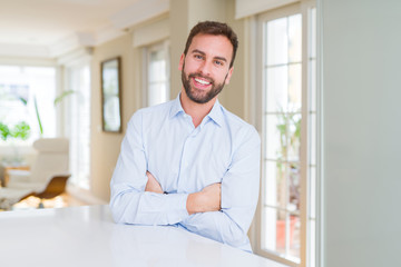 Handsome business man happy face smiling with crossed arms looking at the camera. Positive person.