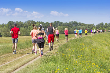 A lot of people on Marathon running in nature