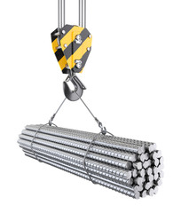 Crane hook hanging on a steel ropes with big steel reinforcement pack.