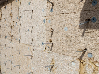 Rockwool heat proofing on the wall of building under construction