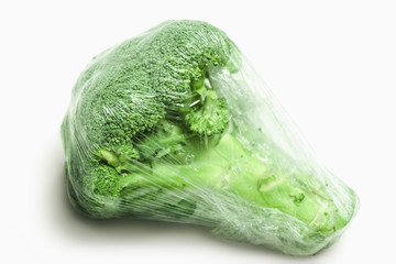 Broccoli in plastic wrap. 