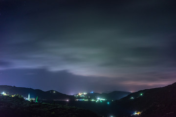 Fototapeta na wymiar Small village in the mountain on the island of Crete at night