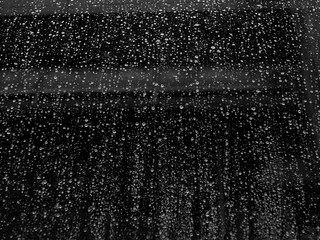 black and white rain drop on glass of window closeup