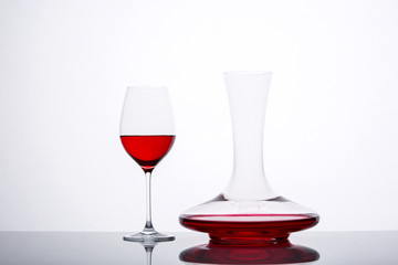 decanter with red wine and glass