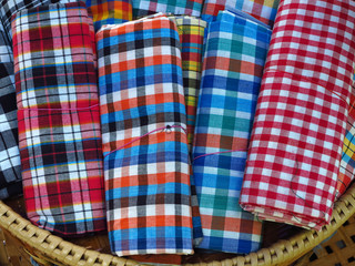 pile of loincloth fabric cloth on basket in market