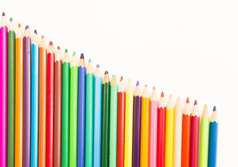 multi-colored pencils for drawing children in school and kindergartens on a white background