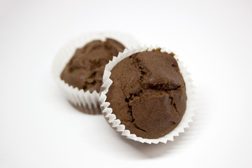Chocolate muffins on white background