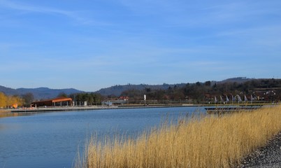 view across a man made lake at Lahr on the site of the Landesgartenschau, Spring scene