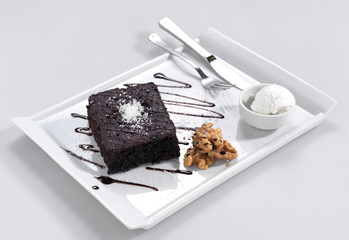 Brownie with coconut, walnut and vanilla ice cream.