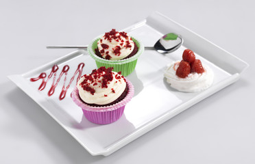 Cup cake with vanilla cream and strawberries.