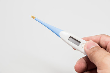 Hand holding the thermometer on white screen isolated