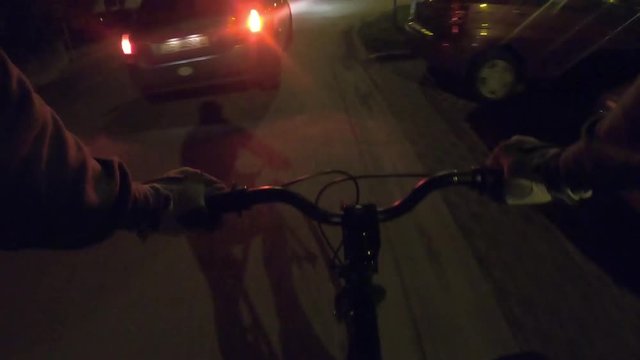 967-07 Bicycle Ride At Night Trough City Streets Car Passing Time Lapse Loop
