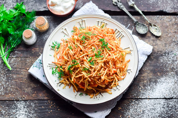 Salad with potato straws and Korean carrot.