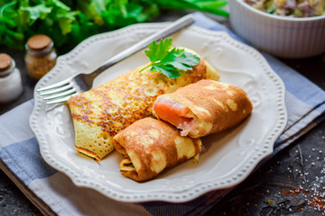 Pancakes thin with meat.