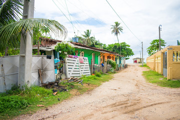 Ilha de Itamaraca, Brazil - Circa March 2019: Poorly built small colorful houses near the beach