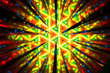 Repetitive pattern by reflections of an image in mirrors. Color kaleidoscopic image.
