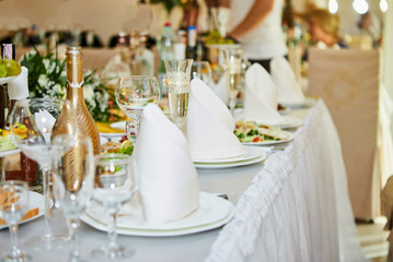 Empty glasses set for champagne and  wine in restaurant. Table setting for celebration