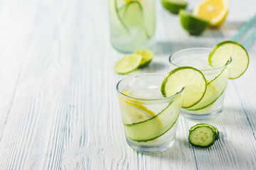 Cucumber infused lime iced water. Selective focus, space for text.