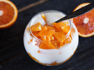 Orange parfait with homemade yogurt, jam and slices