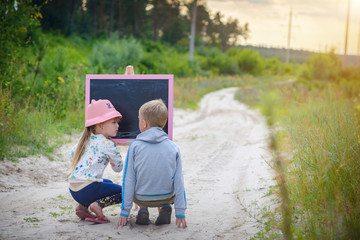 Children draw in the forest