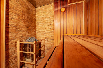 Fototapeta na wymiar Bath and sauna in traditional old Russian style with wooden walls