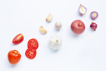 Fresh vegetables on white background.  Tomato, Red onion, garlic,