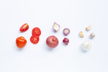 Fresh vegetables on white background.  Tomato, Red onion, garlic,