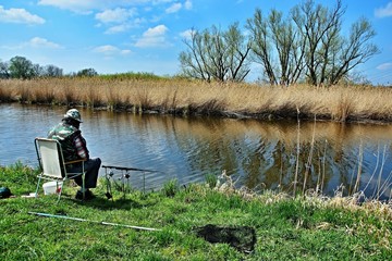 Fototapeta na wymiar Czech Republic-Fisherman by the water