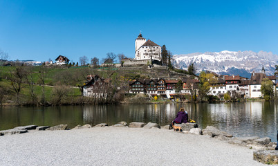 Werdenberg, SG / Switzerland - March 31, 2019: tourists enjoy a visit to idyllic and historic...