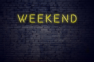 Night view of neon sign with text weekend - obrazy, fototapety, plakaty