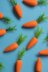 Easter bunny carrots on a blue background