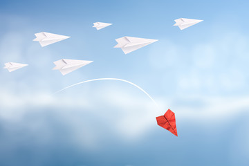 Business failure concept with crumpled red plane falling from the sky