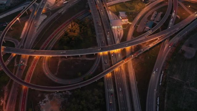 Aerial view and Top view. Traffic of expressways at night, motorways and highways
