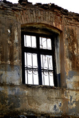 window  of a ruin of an old abandoned building in village of ljubojno in macedonia