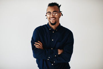 Confident young African American entrepreneur standing against a