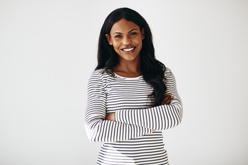 Confident African American female entrepreneur standing against