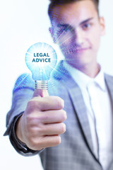 The concept of business, technology, the Internet and the network. A young entrepreneur working on a virtual screen of the future and sees the inscription: Legal advice