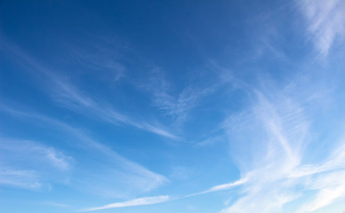 Naklejka na ściany i meble Blue sky and white streaks of light clouds
