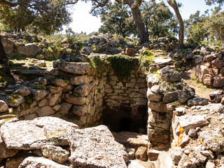 Fototapeta premium Sacred Source entrance archaeological site of Noddule in the megalithic circle and large circular hut in the new archaeological site in Sardinia , ITALY.
