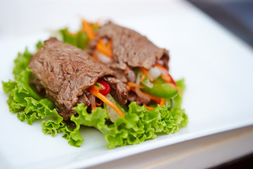 Rolled grilled beef with vegetables