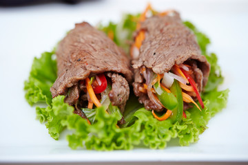 Rolled grilled beef with vegetables