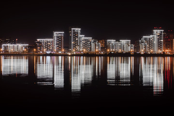 City at night, water reflections  and equalizer