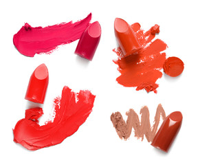 Set of different lipstick swatches on white background, top view