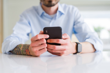 Close up of business man working using smartphone