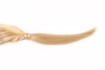 Light blond hair tress on white isolated background. Human, natural hairstyle with copy and free...