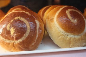 homemade loaves of sweet bread, handmade, homemade. round shape of the food, spiral of the grain of the flour
