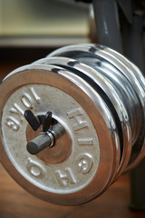 Obraz premium Dumbbell on a rack at gym 