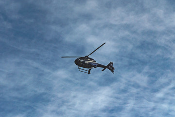 helicopter in flight. helicopter against the blue sky.